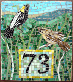 house number sign with birds, bobolinks