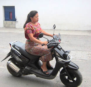 guatemalan woman on motorbike