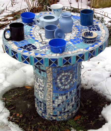 Blue well cover mosaic in winter